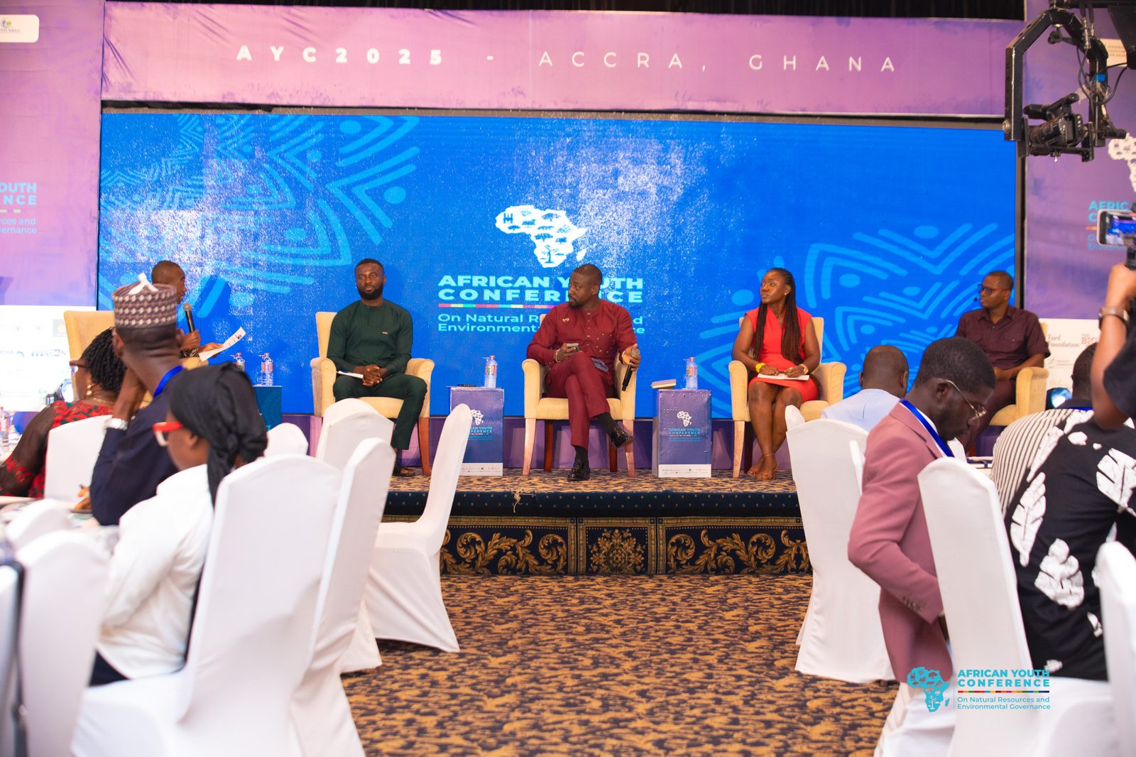 A plenary panel on the main stage of AYC 2025